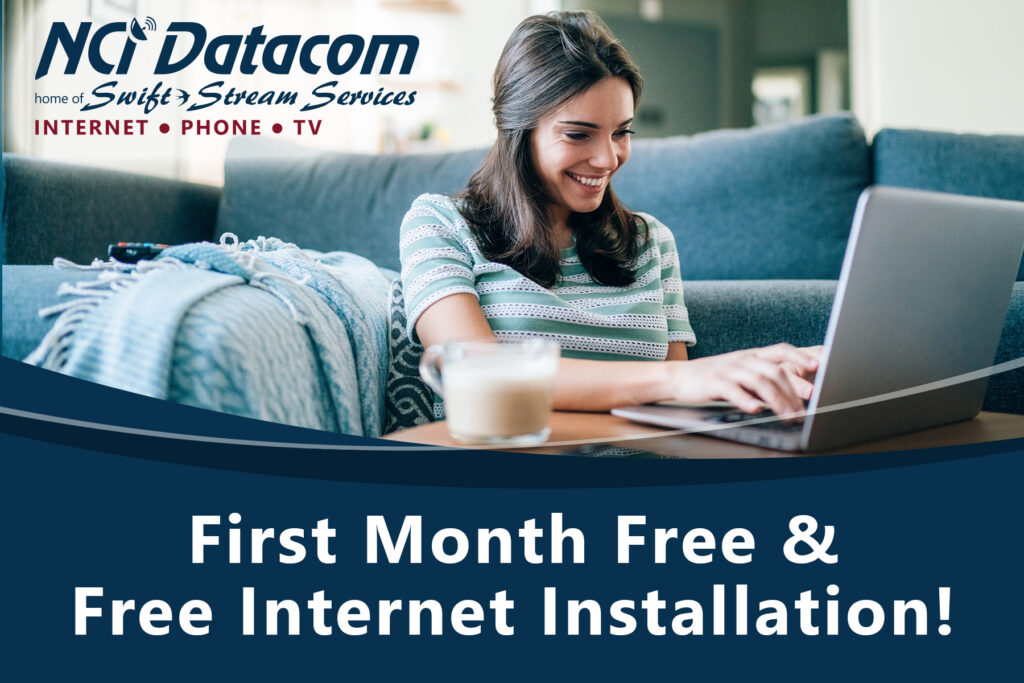 First month free and free internet installation. Photo of a smiling woman typing on a laptop.