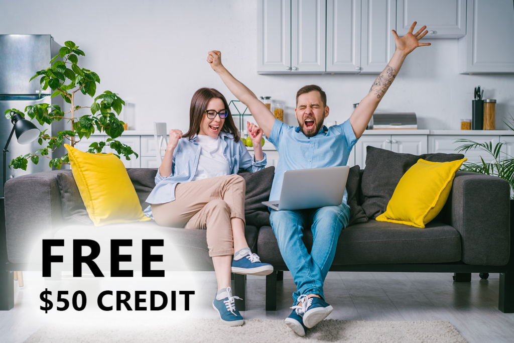 Free $50 credit. Click for details. Excited woman and man sitting on a couch.